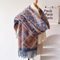 Detailed view of a vintage geometric jacquard winter scarf with stylish fringe edges. - Sky Blue
