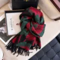 Floral pattern cozy tassel winter scarf detail view, soft fabric texture lifestyle shot - Purple