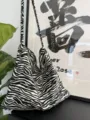 Closeup detail of stylish black and white zebra print canvas shoulder bag, soft textured fabric. - Zebra Jasper