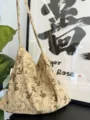 Detail view of the beige corduroy shoulder bag featuring cute rabbit prints and soft texture. - Little Rabbit