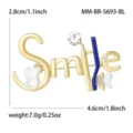 Gold tone dental theme brooch detail showing smile lettering, toothbrush, and sparkling crystal. - Creative Blue Toothbrush Style (MM-BR-5693-BL) / Blue