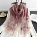Detailed view of women's silk wool embroidered scarf, elegant pink floral design for women. - Purple