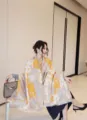 Close-up detail of women's autumn winter imitation cashmere printed scarf shawl with cute cats. - Yellow Big-Eyed Cute Cat