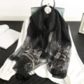 Elegant black silk blend shawl featuring exquisite floral embroidery and sparkling rhinestone details. - Black