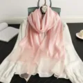 Elegant pink silk wool scarf for women, featuring a shimmering gold grid pattern. Perfect chic shawl. - Light Pink