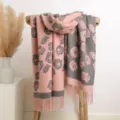 Detailed close-up view of women pink grey floral knit winter warm scarf tassel shawl. - Pink