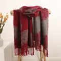 Detailed view of the red and grey reversible feather pattern tassel winter warm scarf. - Burgundy