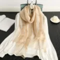 Elegant women's silk wool striped scarf with shimmering gold thread, lightweight autumn shawl. - Nude