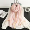 Detailed view of women pink silk wool blend scarf featuring elegant gold metallic stripes. - Pink
