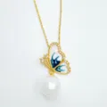 Detail view of gold plated butterfly pendant necklace with white enamel and dangling pearl. - Pendant Only (Without Chain) - Gold (Artificial Pearl)