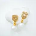 Elegant gold-plated cubic zirconia baguette and white pearl drop earrings for women. - Stud Earrings - Natural Pearl / Gold