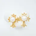 Detail shot of vintage pearl cross earrings, micro-paved cubic zirconia, gold plated finish. - Stud Earrings / Faux Pearl / Gold