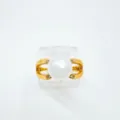 Gold-plated pearl ring with sparkling diamond accents, elegant fine jewelry detail view. - Gold (Acrylic Pearl)
