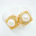 Elegant gold pearl stud earrings with sparkling rhinestones and white shell details. - Stud Earrings (Natural Pearl) / White-Gold