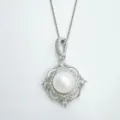 Elegant silver pearl pendant necklace with sparkling cubic zirconia and chic quatrefoil design. - Pendant With Artificial Pearl (Without Chain) / White Shell - Silver