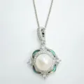 Elegant pearl pendant necklace with sparkling rhinestones and green shell inlay design. - Abalone Shell Clover Pendant With Artificial Pearl (Without Chain) / Silver