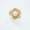 Close-up of a delicate gold plated camellia flower pearl ring showcasing intricate details. - Ring - White - Artificial Pearl