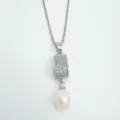 Detailed close-up view of silver-toned pendant necklace with sparkling zircon and dangling pearl. - Pendant / Artificial Pearl (Without Chain) / Silver