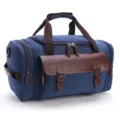 Blue canvas travel duffel bag with brown leather trim, casual large capacity shoulder bag. - Dark Blue