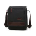 Men casual canvas shoulder bag in black with brown leather trim and adjustable strap. - M / Black