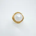 Detail shot of the elegant gold plated pearl pendant mounting, featuring a geometric sparkling frame. - Ring (Acrylic Bead) / Large / Gold
