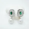 Close-up detail of vintage rectangular green gemstone pearl drop earrings with mother pearl. - Emerald Rectangle Stud Earrings (Acrylic Bead) / Silver
