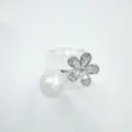 Detailed shot of elegant pearl and crystal flower ring sparkling cubic zirconia design piece. - Ring / Silver (Acrylic Pearl)