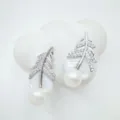 Mother of pearl feather earrings detail, sparkling crystal paved fashion jewelry close-up. - Stud Earrings / Acrylic Beads / Silver