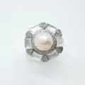 Close-up of elegant hexagonal pearl ring setting with mother of pearl and pave cubic zirconia. - White Shell Ring (Artificial Pearl) / Silver
