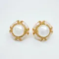 Detailed view of luxury pearl stud earrings with gold ornate metal frame and glitter design. - Stud Earrings / Natural Pearl (11mm) / Gold