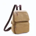 Casual canvas backpack in khaki color with brown straps, ideal for daily school and street use. - Khaki
