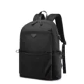 Black polyester casual laptop backpack with USB port and stylish triangle patch design for use. - Black