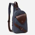 Canvas sling backpack, casual dual-use chest bag for men and women with brown leather trim. - Blue