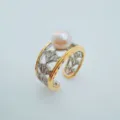 Close-up detail view of the elegant open pearl ring featuring dual-tone metal and cubic zirconia. - Hollow Ring Freshwater Pearl