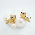 Exquisite gold-plated tiger earrings featuring sparkling rhinestones and elegant pearls. - Tiger - Acrylic Beads