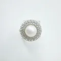 Exquisite pearl ring detail showcasing double halo zirconia setting and elegant polished metal. - Ring / Acrylic Beads / Silver