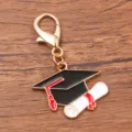 Graduation cap keychain alloy charm, elegant black and white enamel backpack pendant gift. - 1 Piece (23x28mm) With Lobster Clasp