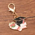 Graduation season metal charm keychain featuring mortarboard cap books and flower bouquet. - 1 Piece (22x27mm) With Lobster Clasp