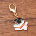 Graduation alloy keychain charm pendant featuring mortarboard, books and diploma design. - 1 Piece (21x25mm) With Lobster Clasp