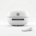 Mini cordless desktop vacuum cleaner in white with nozzle attachment and power button. - Basic Type-C Charging / White