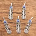 Silver evil eye feather pendant detail showing intricate hollow metalwork and blue cabochon. - 12*48mm / Ancient Silver