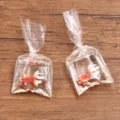 Transparante hars goudvis in zak hanger DIY knutselaccessoire, schattige mini bedel voor sieraden. - Goudvis in Waterzak