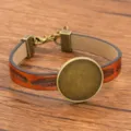 Braunes PU-Leder DIY-Armband mit bronzenem Legierungsteller und Feder-Prägung Variante - 24mm Tablett Antikbronze / Orange