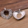 Detail shot showing front and back of silver alloy heart angel wings DIY jewelry pendant. - Angel Wings Hollow Heart Pendant / 26x32mm / Antique Silver