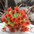 Detailed close-up view of vibrant orange artificial flower bouquet for home decoration - Orange