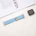 Detailed view of blue elastic nylon braided strap with cute cat charm for smart watch. - Light Blue