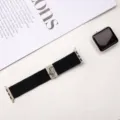 Detailed view of elastic nylon braided watch band with cute cat metal buckle for Apple Watch. - Black