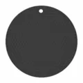 Detail view of round silicone hot mat with honeycomb texture and hanging hole for kitchen use. - Round / Black