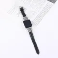 Leather strap compatible with Apple Watch featuring stylish metallic Chinese knot design. - Black