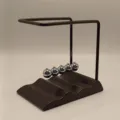 Detailed view of the wave base newton's cradle balance balls desk physics toy and home decor. - Black